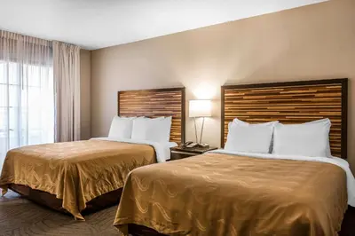 a hotel room with two beds and a window at Quality Inn Fallbrook I-15 in Fallbrook