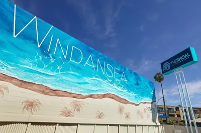 a mural on the side of a building with a sign at The Shoal Hotel La Jolla Beach in San Diego