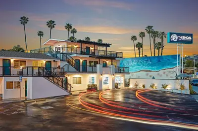 a building with a road in front of it at The Shoal Hotel La Jolla Beach in San Diego