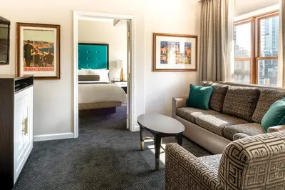 a hotel room with a couch and a bed at WorldMark San Diego - Balboa Park in San Diego