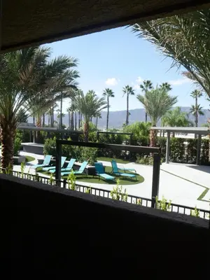 a view from the balcony of a resort with palm trees at Econo Lodge Lake Elsinore Casino in Lake Elsinore