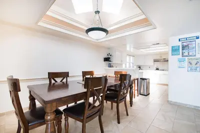 a dining room with a wooden table and chairs at Luxury Penthouse with Elevator - Sleeps 10+ - Family Friendly Sun / Surf / Sand in San Diego