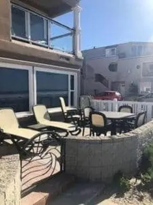 a group of chairs and tables on a patio at Luxury Penthouse with Elevator - Sleeps 10+ - Family Friendly Sun / Surf / Sand in San Diego