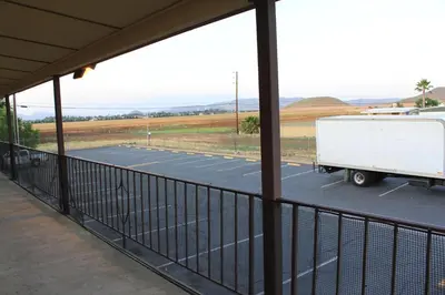a white truck parked in a parking lot at Menifee Inn in Menifee