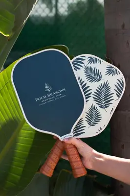 a hand holding a sign with a plant on it at Four Seasons Residence Club Aviara in Carlsbad
