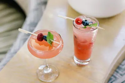 two cocktails sitting on a table next to each other at Four Seasons Residence Club Aviara in Carlsbad