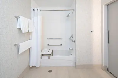 a bathroom with a bath tub and a toilet at Holiday Inn Express & Suites - Murrieta by IHG in Murrieta