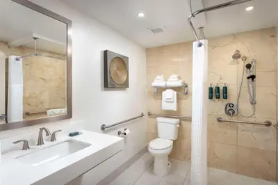 a bathroom with a sink and a toilet and a shower at DoubleTree by Hilton San Diego Bayside in San Diego