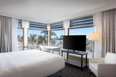 a hotel room with a bed and a large window at DoubleTree by Hilton San Diego Bayside in San Diego