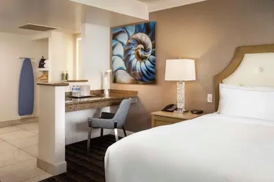 a hotel room with a bed and a desk at DoubleTree by Hilton San Diego Bayside in San Diego