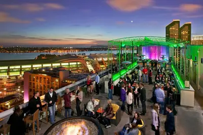 a crowd of people standing on the roof of a building at San Diego Marriott Gaslamp Quarter in San Diego