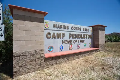 a sign for a camp pendleton home of live at Days Inn by Wyndham Oceanside in Oceanside