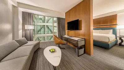 a hotel room with a couch and a bed at Andaz San Diego, By Hyatt in San Diego