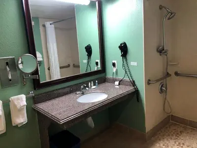 a bathroom with a sink and a mirror at Quality Inn Hemet - San Jacinto in Hemet