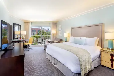 a hotel room with a large bed and a desk at Loews Coronado Bay Resort in San Diego