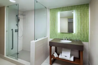 a bathroom with a sink and a glass shower at The Westin San Diego Gaslamp Quarter in San Diego