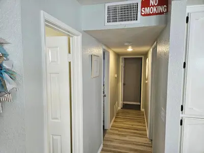 a hallway with a no smoking sign on the ceiling at Luna Azul, cozy condo only steps to Mission Beach! Free Internet in San Diego