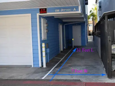 a blue building with a speed limit sign on it at Luna Azul, cozy condo only steps to Mission Beach! Free Internet in San Diego
