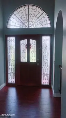 an empty room with two doors and two windows at Rancho Garden Home in Rancho Santa Fe