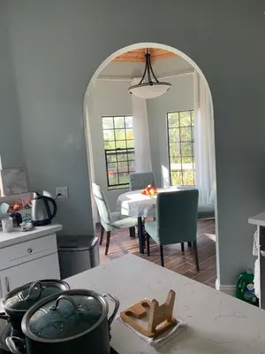 a kitchen with a table and chairs and a mirror at Rancho Garden Home in Rancho Santa Fe