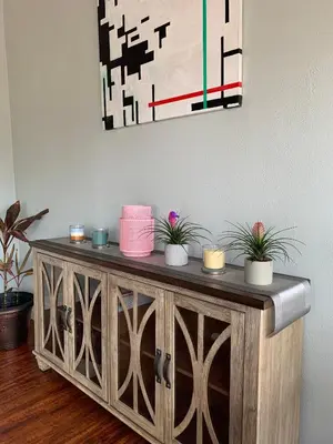 a wooden cabinet with plants on top of it at Rancho Garden Home in Rancho Santa Fe