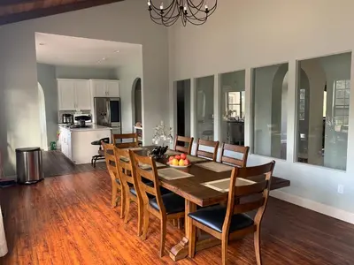 a kitchen and dining room with a table and chairs at Rancho Garden Home in Rancho Santa Fe