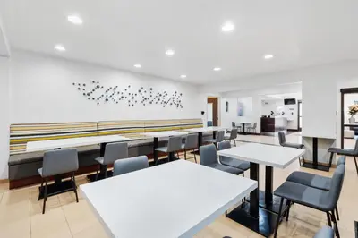 a dining room with white tables and chairs at Best Western San Diego/Miramar Hotel in Miramar
