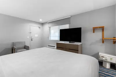 a bedroom with a bed and a flat screen tv at Best Western San Diego/Miramar Hotel in Miramar