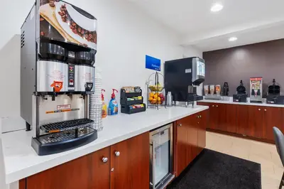 a kitchen with a counter with aasteryasteryasteryasteryasteryasteryasteryasteryastery at Best Western San Diego/Miramar Hotel in Miramar