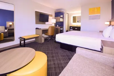 a hotel room with a bed and a desk at Comfort Inn Encinitas Near Legoland in Encinitas