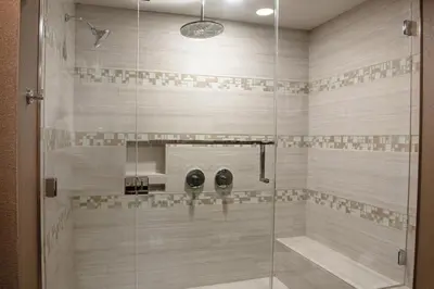 a bathroom with a shower with a glass door at Sheraton Mission Valley San Diego Hotel in San Diego