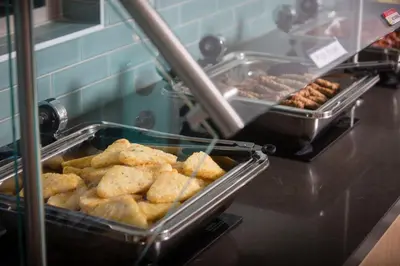 a buffet line with a bunch of pastries and other food at Ocean Park Inn in San Diego