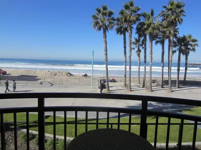 a view of a beach with palm trees and the ocean at Ocean Park Inn in San Diego