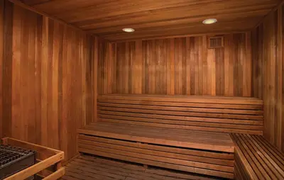 a sauna with wooden walls and a wooden floor at Club Wyndham Oceanside Pier Resort in Oceanside