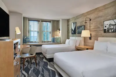 a hotel room with two beds and a television at Hotel Republic San Diego, Autograph Collection in San Diego