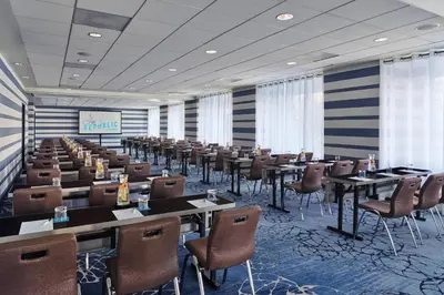 a large conference room with tables and chairs in it at Hotel Republic San Diego, Autograph Collection in San Diego