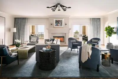 a living room with couches and chairs and a fireplace at Waldorf Astoria Monarch Beach Resort & Club in Dana Point