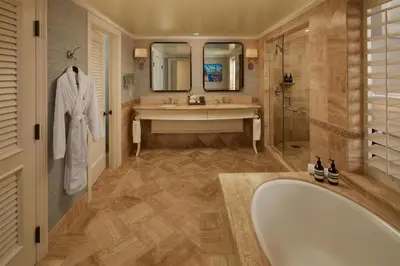 a bathroom with a tub and a sink and a shower at Waldorf Astoria Monarch Beach Resort & Club in Dana Point