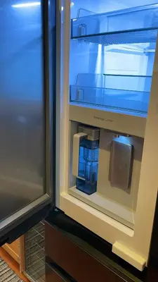 a refrigerator door is open with a drink in it at Newport Beach House 1 block from the beach FREE pickleball courts and 6 beach cruisers in Newport Beach
