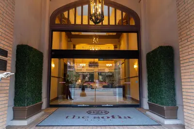 a entrance to a store with a large glass window at The Sofia Hotel in San Diego