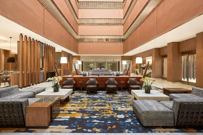 a lobby of a hotel with couches and chairs at Hyatt Regency Newport Beach West in Newport Beach