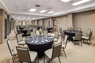 a conference room with tables and chairs at Country Inn & Suites by Radisson, San Diego North, CA in Mira Mesa