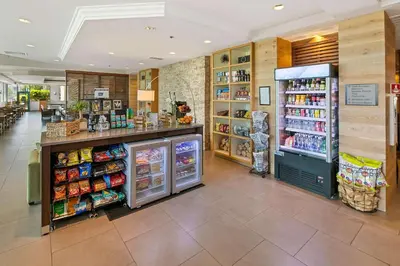 a grocery store with a refrigerator and other food items at Country Inn & Suites by Radisson, San Diego North, CA in Mira Mesa