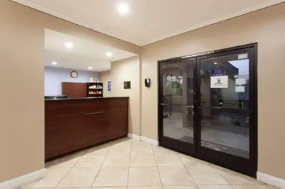 a shop with a glass door in a room at Super 8 by Wyndham El Cajon San Diego in El Cajon