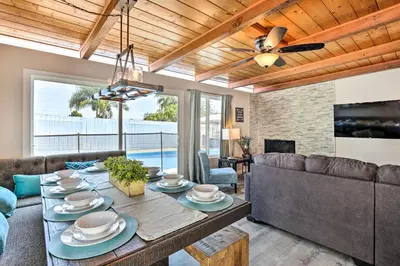 a living room with a table and a couch at Chic Central San Diego House with Private Pool! in San Diego