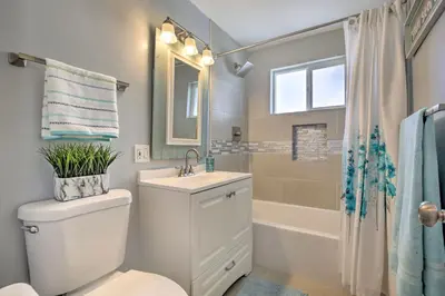 a bathroom with a toilet and a sink and a shower at Chic Central San Diego House with Private Pool! in San Diego