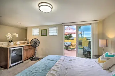 a bedroom with a bed and a television and a patio at Sunny San Diego Escape Less Than 2 Miles to Pacific Beach! in San Diego