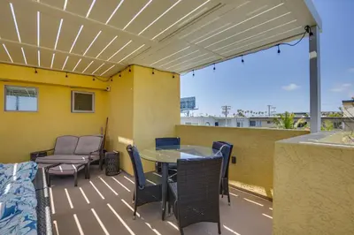 a patio with a table and chairs on a balcony at Sunny San Diego Escape Less Than 2 Miles to Pacific Beach! in San Diego
