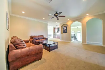 a living room with two couches and a ceiling fan at Luxe Wine Country Estate with Orchard-Facing Balcony in Temecula