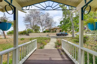 a wooden walkway leading to a house with a driveway at Escondido Vineyard Estate Walk to Wineries! in Escondido